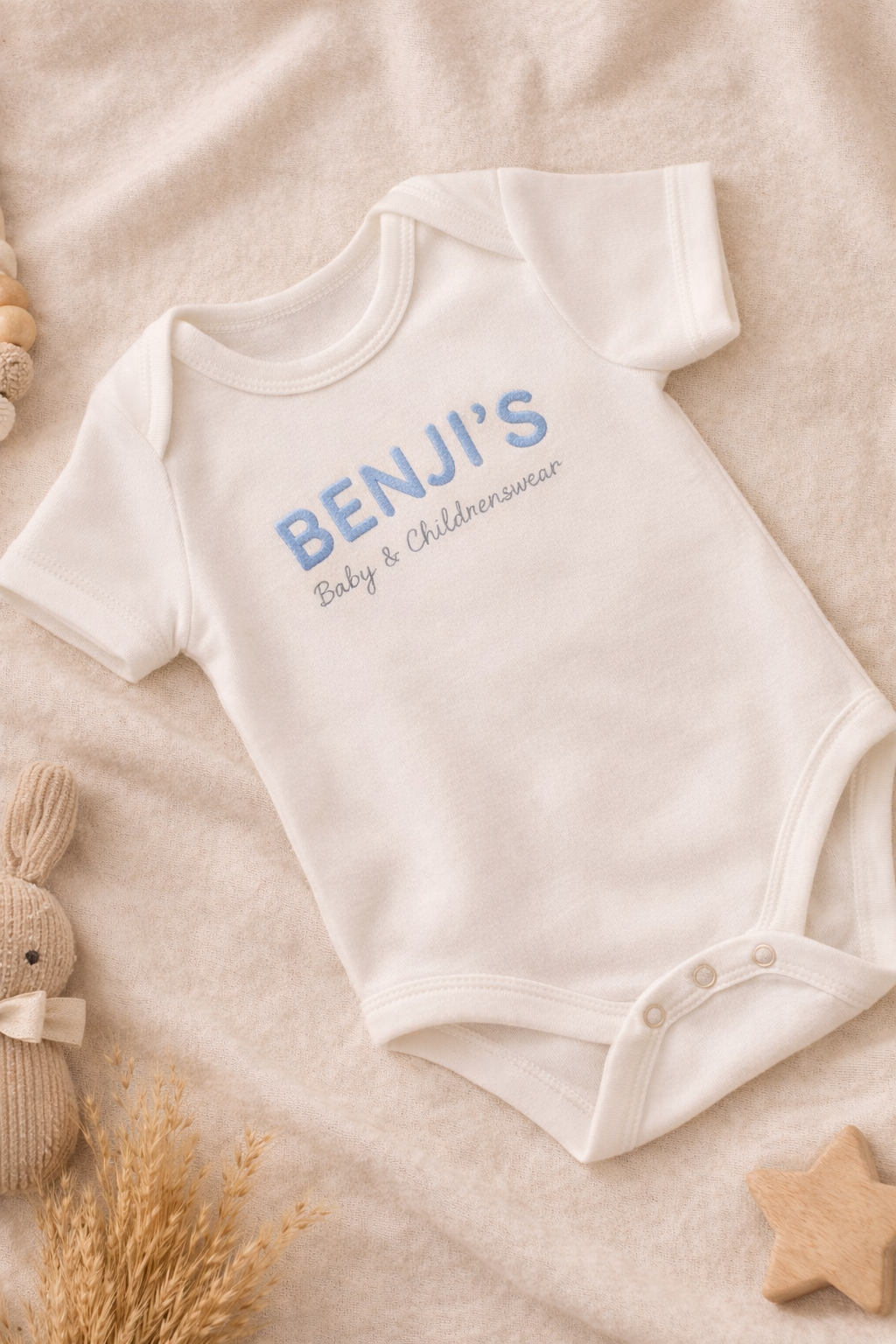 BENJI’S Baby White Cotton Onesie – Soft Blue Embroidered Logo