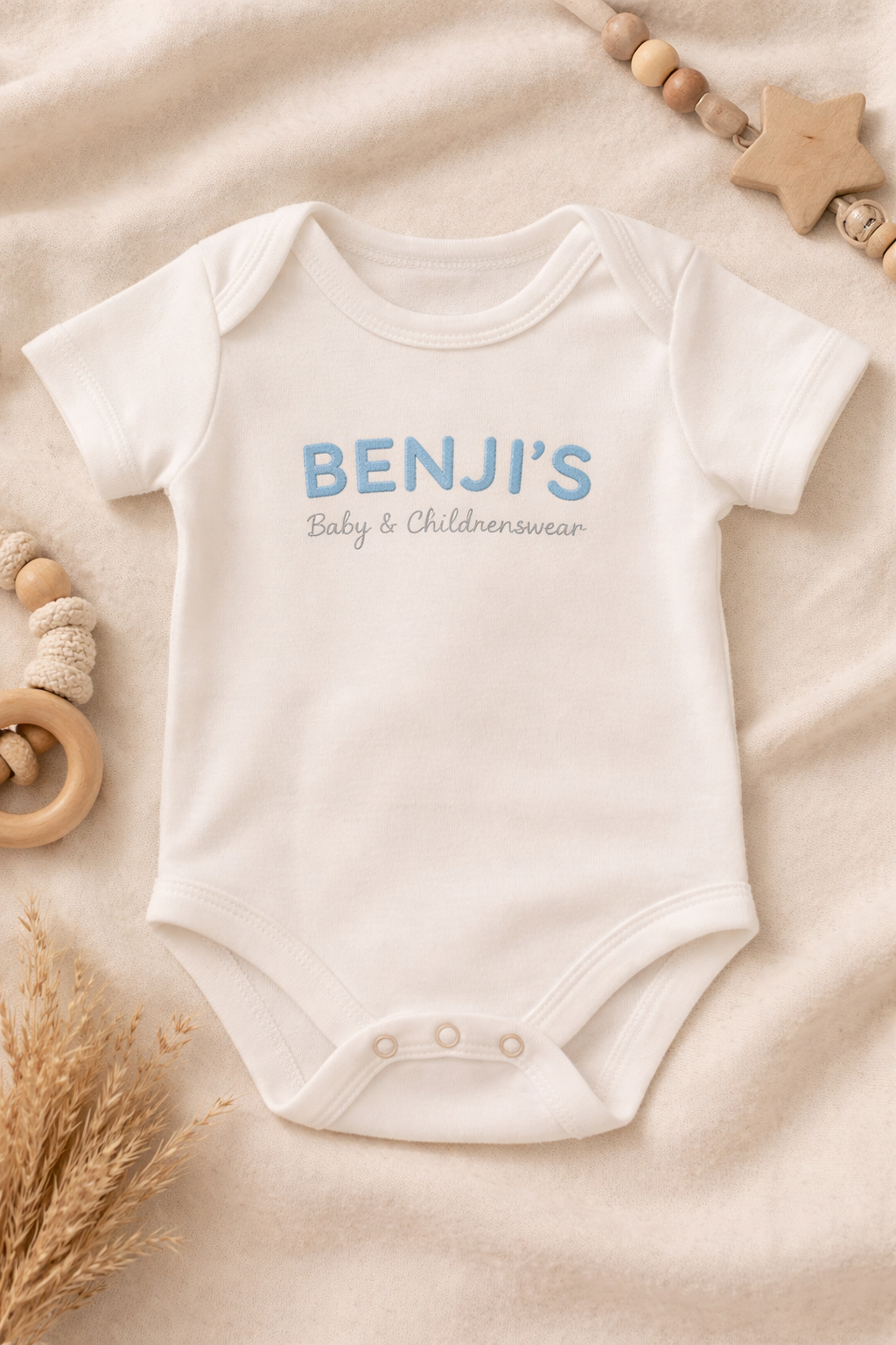 BENJI’S Baby White Cotton Onesie – Soft Blue Embroidered Logo
